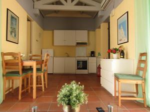 A kitchen or kitchenette at Barbati Beach Apartments