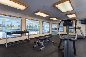 a gym with two treadmills and two exercise bikes at Shilo Inn Suites - Idaho Falls in Idaho Falls