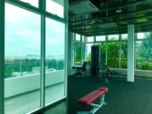 an empty gym with a view of a balcony at Sunset Seaview Vacation Condos @ Infinity Avenue in Kota Kinabalu