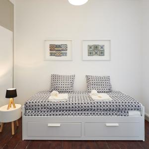 Postel nebo postele na pokoji v ubytování Love inn Bairro Alto