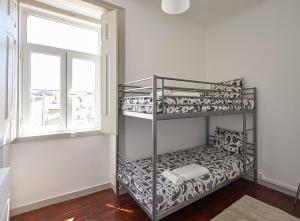 Postel nebo postele na pokoji v ubytování Love inn Bairro Alto