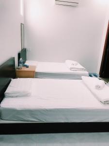 Postel nebo postele na pokoji v ubytování Phong Lan Guesthouse
