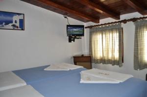 Posteľ alebo postele v izbe v ubytovaní Eros-Iros Portside Stays Skiathos