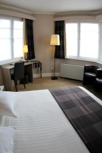 Postel nebo postele na pokoji v ubytování Hotel Arriate