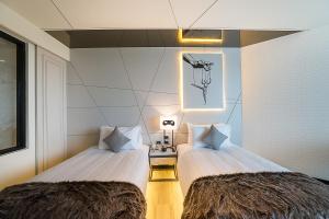 Ein Bett oder Betten in einem Zimmer der Unterkunft Mera Mare Pattaya