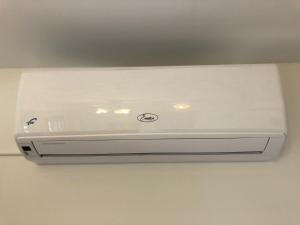 a white air conditioner hanging from a ceiling at Tesorillo in Almuñécar