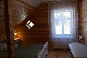 Postel nebo postele na pokoji v ubytování Guest House Ziedkalni