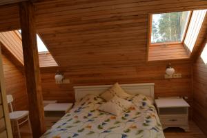 Postel nebo postele na pokoji v ubytování Guest House Ziedkalni
