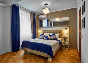 Postel nebo postele na pokoji v ubytování ANTARES Apart hotel