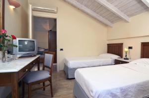 Postel nebo postele na pokoji v ubytování Harmony Hotel Apartments