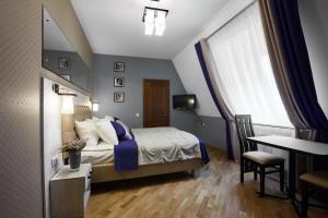 Postel nebo postele na pokoji v ubytování ANTARES Apart hotel
