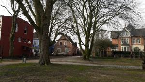 a group of houses and trees in a park at Haus am Hafen in Leer