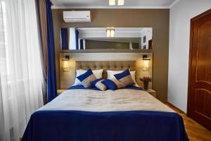 Postel nebo postele na pokoji v ubytování ANTARES Apart hotel