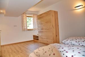 A bed or beds in a room at Residence Blumenthalerhof