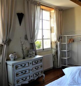 Postel nebo postele na pokoji v ubytování Maison Olleris
