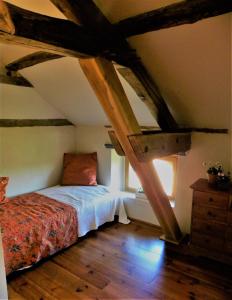 Postel nebo postele na pokoji v ubytování Maison Olleris