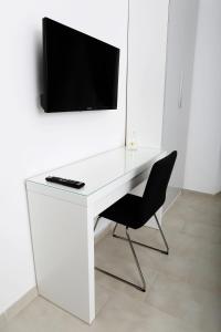 A television and/or entertainment centre at ImeraRooms