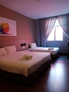 Katil atau katil-katil dalam bilik di Lemon 8 Boutique Hotel @ Melaka