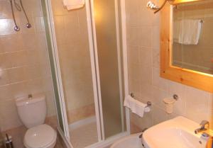 a bathroom with a shower and a toilet and a sink at Residence Letojanni Taormina in Letojanni +26 photos