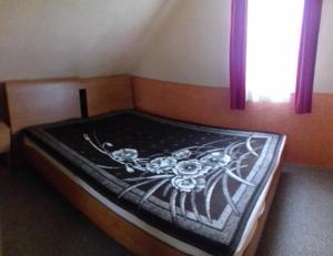 Postel nebo postele na pokoji v ubytování Arany apartman Zsóry