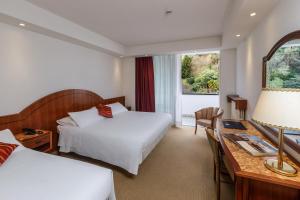Postel nebo postele na pokoji v ubytování Hotel Terme Millepini + 37 fotografií