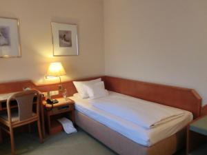 Postel nebo postele na pokoji v ubytování Hotel Heuberg