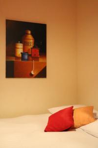 Ein Bett oder Betten in einem Zimmer der Unterkunft Hostellerie de Genève