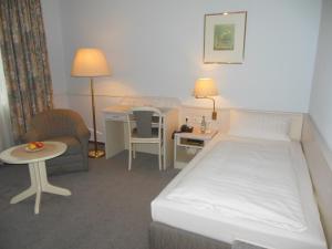 Postel nebo postele na pokoji v ubytování Hotel Heuberg