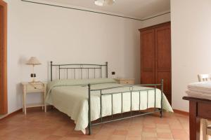 מיטה או מיטות בחדר ב-Agriturismo al Capitello