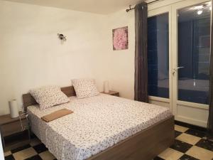 מיטה או מיטות בחדר ב-Le Clos Des Orangers