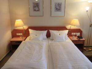 Postel nebo postele na pokoji v ubytování Hotel Heuberg