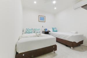 Cama ou camas em um quarto em Hotel Las Lunas