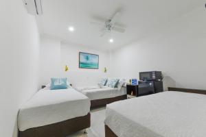 Cama ou camas em um quarto em Hotel Las Lunas