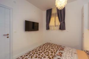 Voodi või voodid majutusasutuse Apartments Monte Re toas