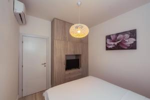 Voodi või voodid majutusasutuse Apartments Monte Re toas