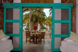 a patio area with a table and chairs at Aite Eco Resort in Palomino