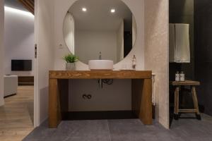 a bathroom with a sink and a mirror at Quinta de Santa Clara in Ponta Delgada