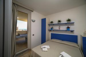 Кровать или кровати в номере Residence Mediterraneo