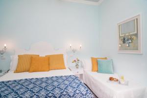 Postel nebo postele na pokoji v ubytování Hotel Villa Nefele