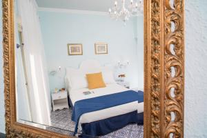 Postel nebo postele na pokoji v ubytování Hotel Villa Nefele
