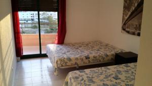 
A bed or beds in a room at Paraíso do Sol - Praia da Rocha
