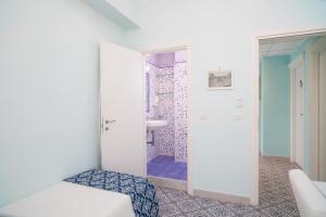 Postel nebo postele na pokoji v ubytování Hotel Villa Nefele