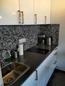 a kitchen with a sink and a counter top at Modern Apartment in Playa del Ingles