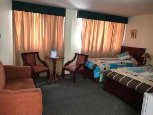 Posteľ alebo postele v izbe v ubytovaní Altura Rooms & Suites