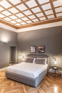 A bed or beds in a room at Relais Della Porta