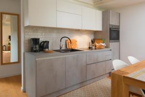 a kitchen with a sink and a counter top at Casa Bel Olivo in Vodnjan