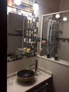 a bathroom with a sink and a mirror at Altos de Obligado in Vuelta de Obligado +17 photos