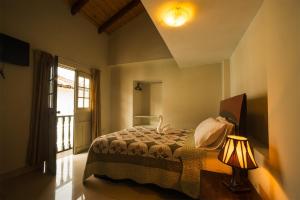 Ένα ή περισσότερα κρεβάτια σε δωμάτιο στο Hostal Catequil