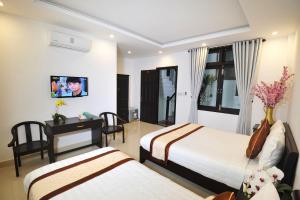 TV a/nebo společenská místnost v ubytování Hoi An Bali Homestay