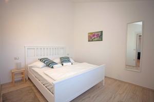 Postel nebo postele na pokoji v ubytování Residence Mama